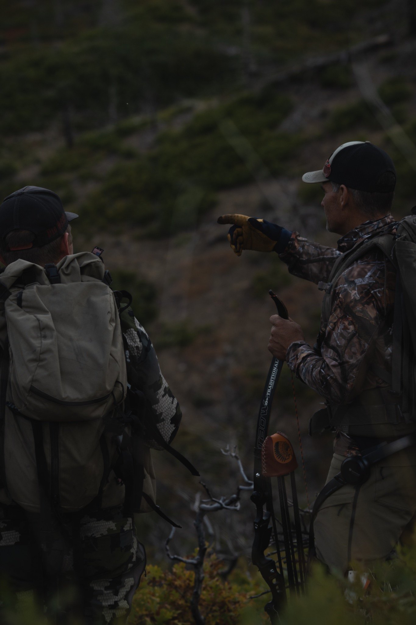 Bucky McCullar pointing across hunting land